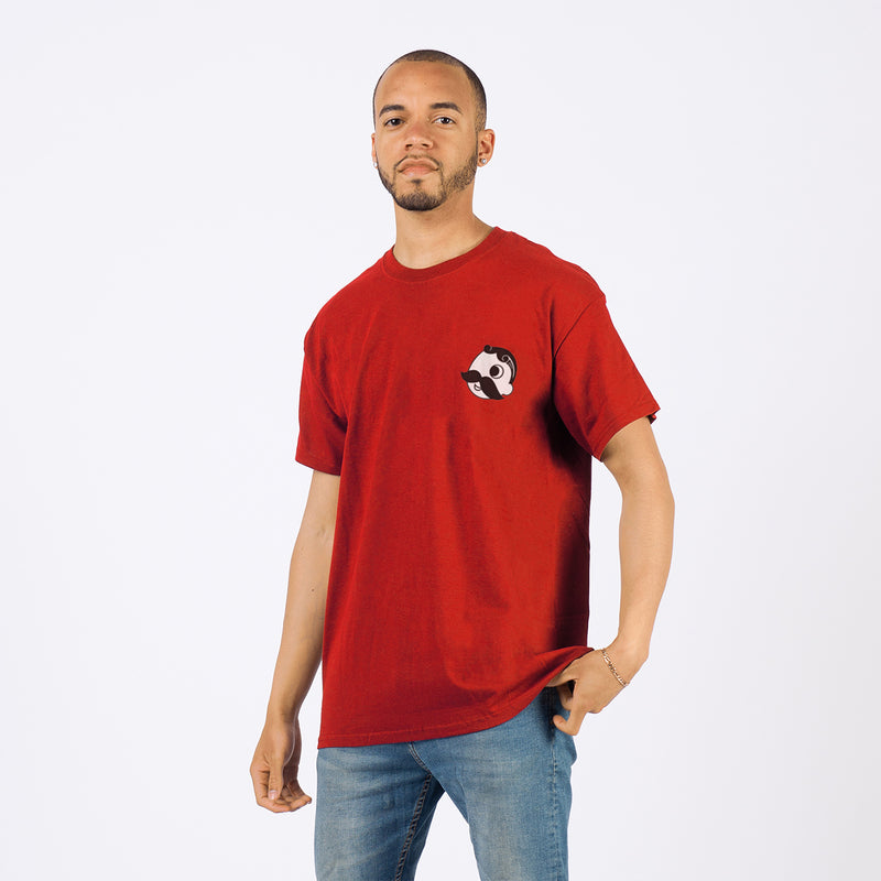 front of man wearing red t-shirt with Mr. Bohs face on the pocket 