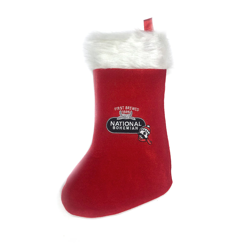 holiday stocking with furry rim and Mr. Boh wearing a beanie and scarf with our black and silver lockup graphic on it