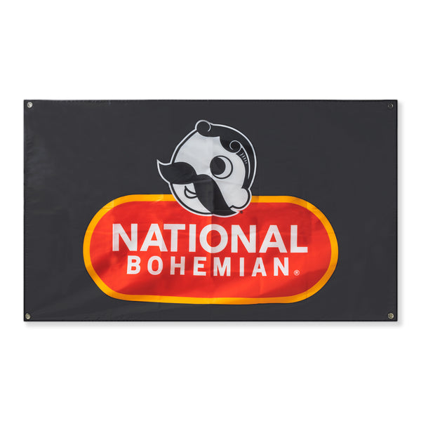 black wall flag of Mr. Bohs face with national bohemian logo below it 